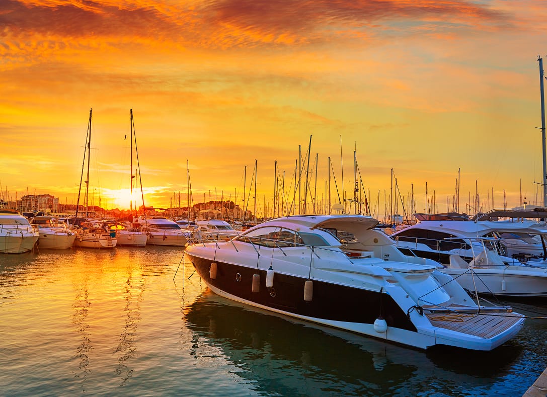 Yachts moored at a marina